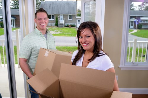 Professional house removals planning in Enfield with packed boxes ready for transport