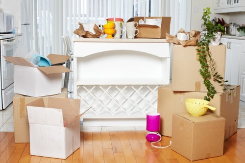 Local Enfield removal team handling furniture and boxes during relocation
