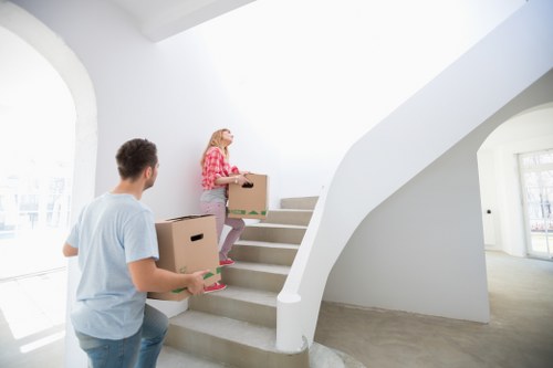 Professional man and van assisting with office relocation in Enfield