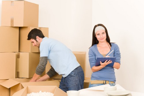 Careful handling of furniture during a flat move in Enfield